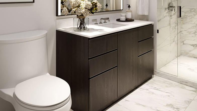 Modern bathroom with marble tile floors, glass shower, and dark vanity at 1000M Apartments in Chicago