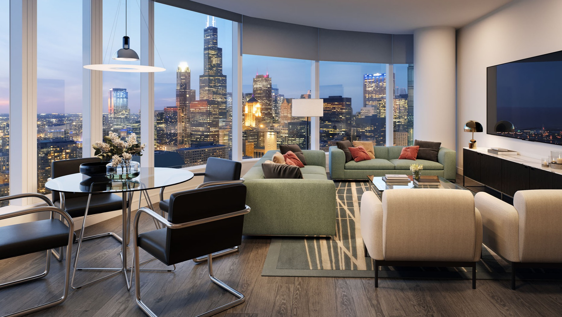 Open living and dining area with large windows, green sofas, and city views at 1000M Apartments in Chicago