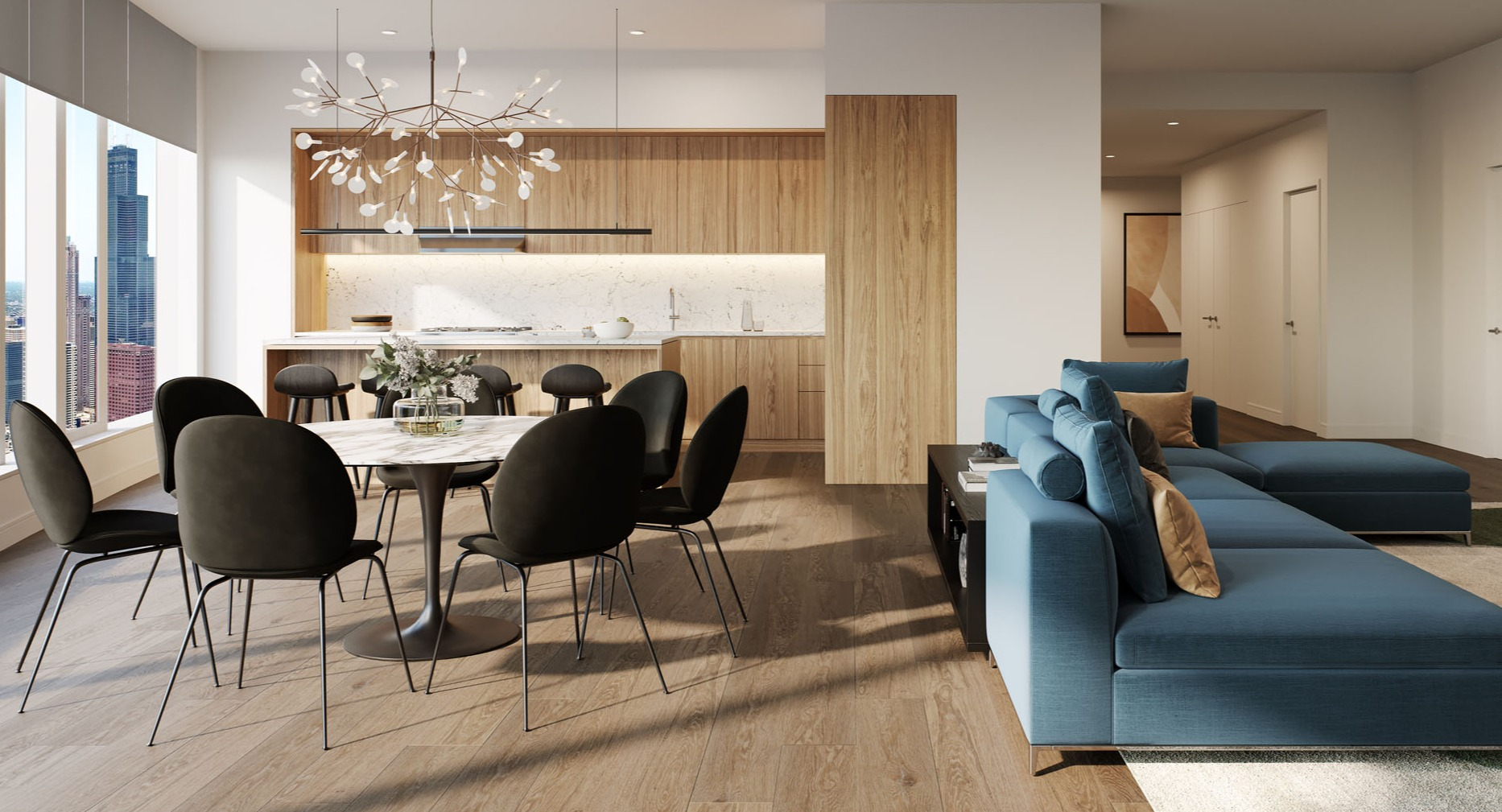 Open concept apartment with wood kitchen, dining table, and blue sectional sofa at 1000M Apartments in Chicago