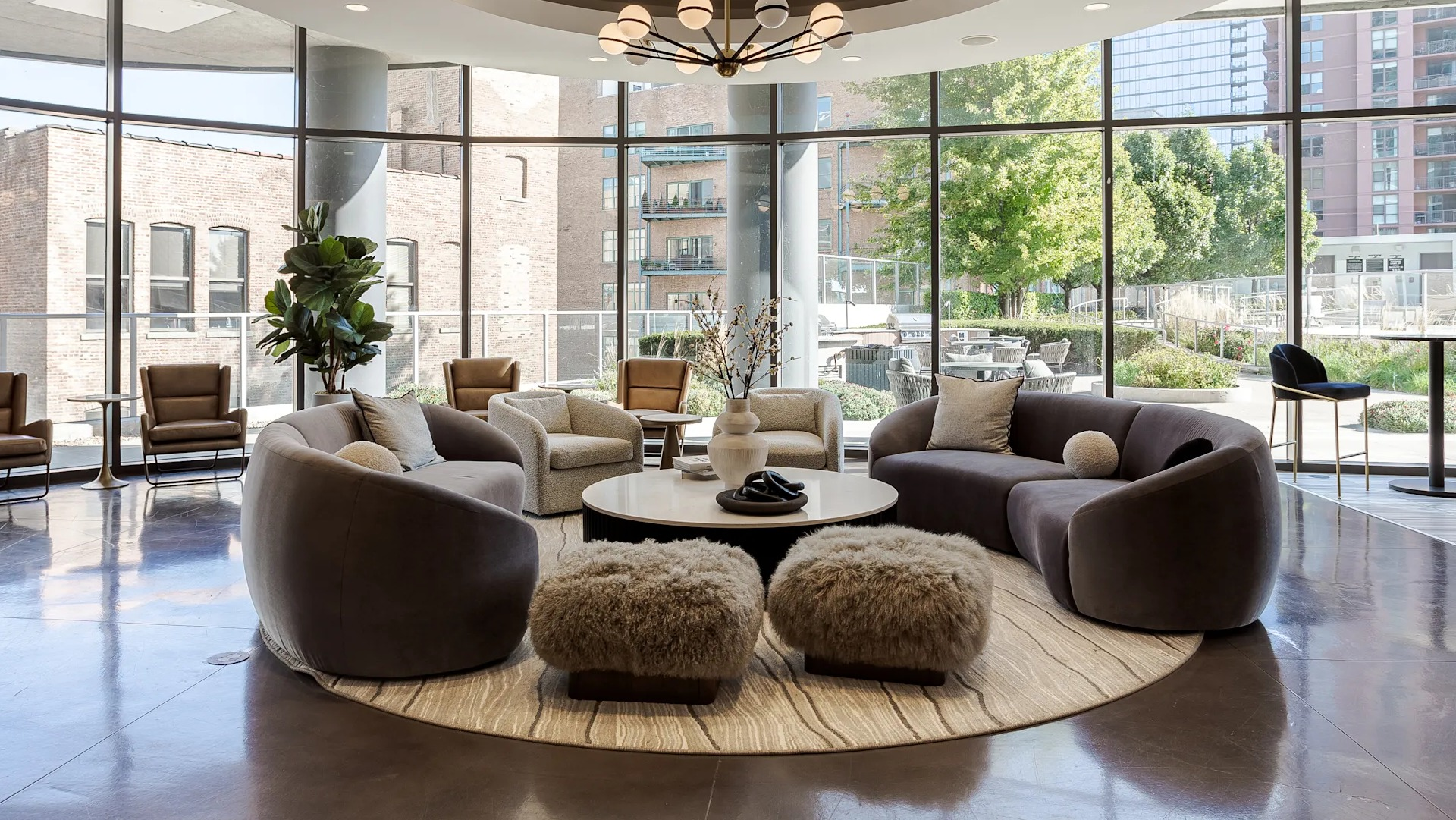 Elegant resident lounge with modern seating, natural light, and stylish décor at 1001 South State apartments in Chicago