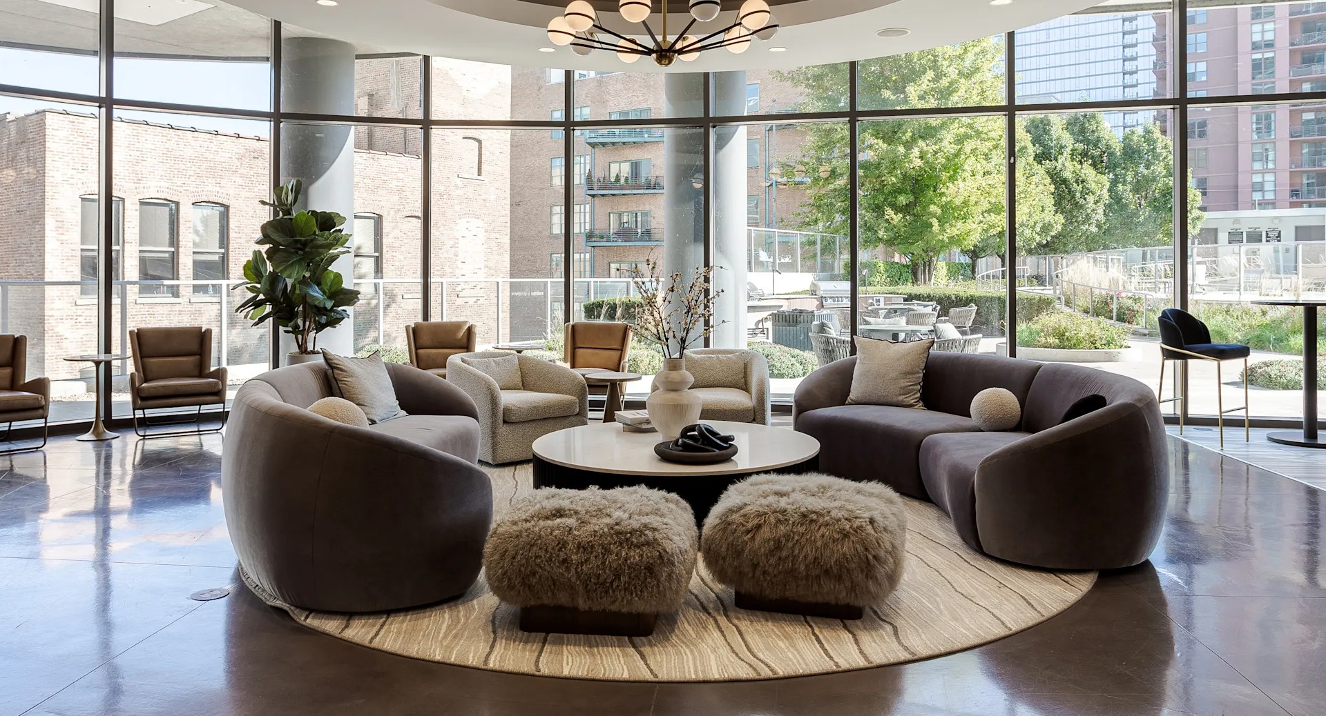 Elegant resident lounge with modern seating, natural light, and stylish décor at 1001 South State apartments in Chicago