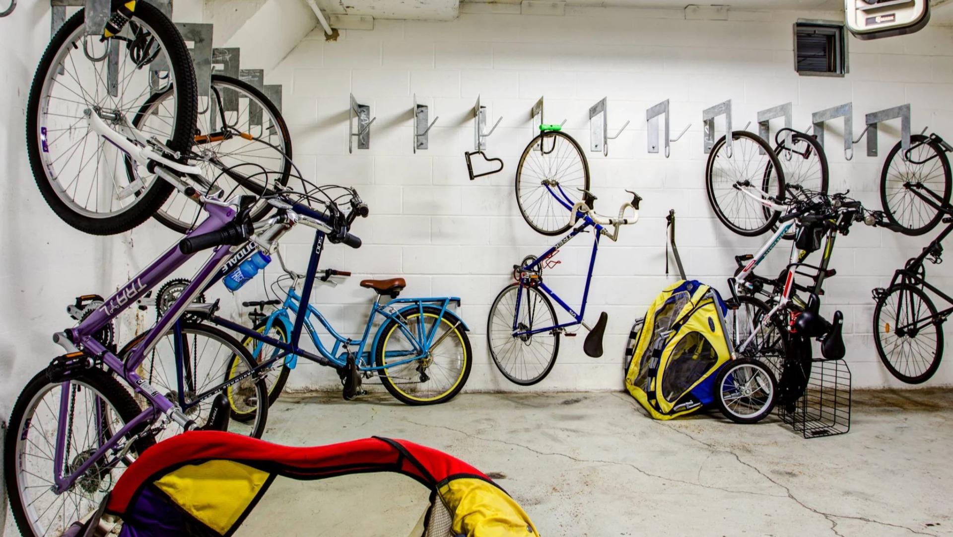 Secure indoor bike storage at 13thirteen Randolph Street Lofts with wall hooks and space for multiple bicycles—perfect for Chicago commuters and riders