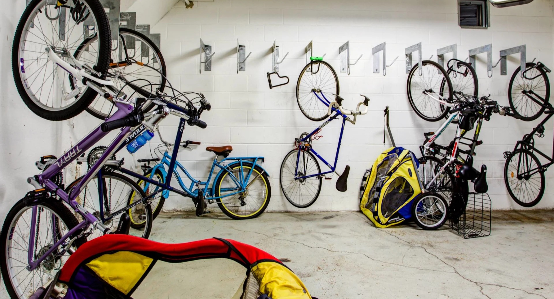 Secure indoor bike storage at 13thirteen Randolph Street Lofts with wall hooks and space for multiple bicycles—perfect for Chicago commuters and riders