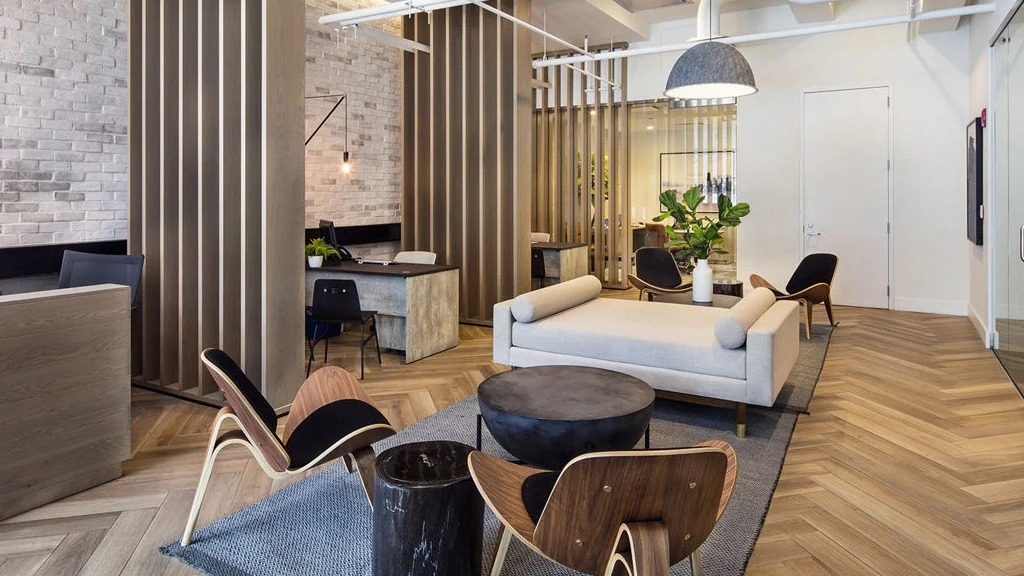 Chic lobby seating area at 1401 S. State Apartments in Chicago, featuring stylish furniture, wooden accents, and a reception desk