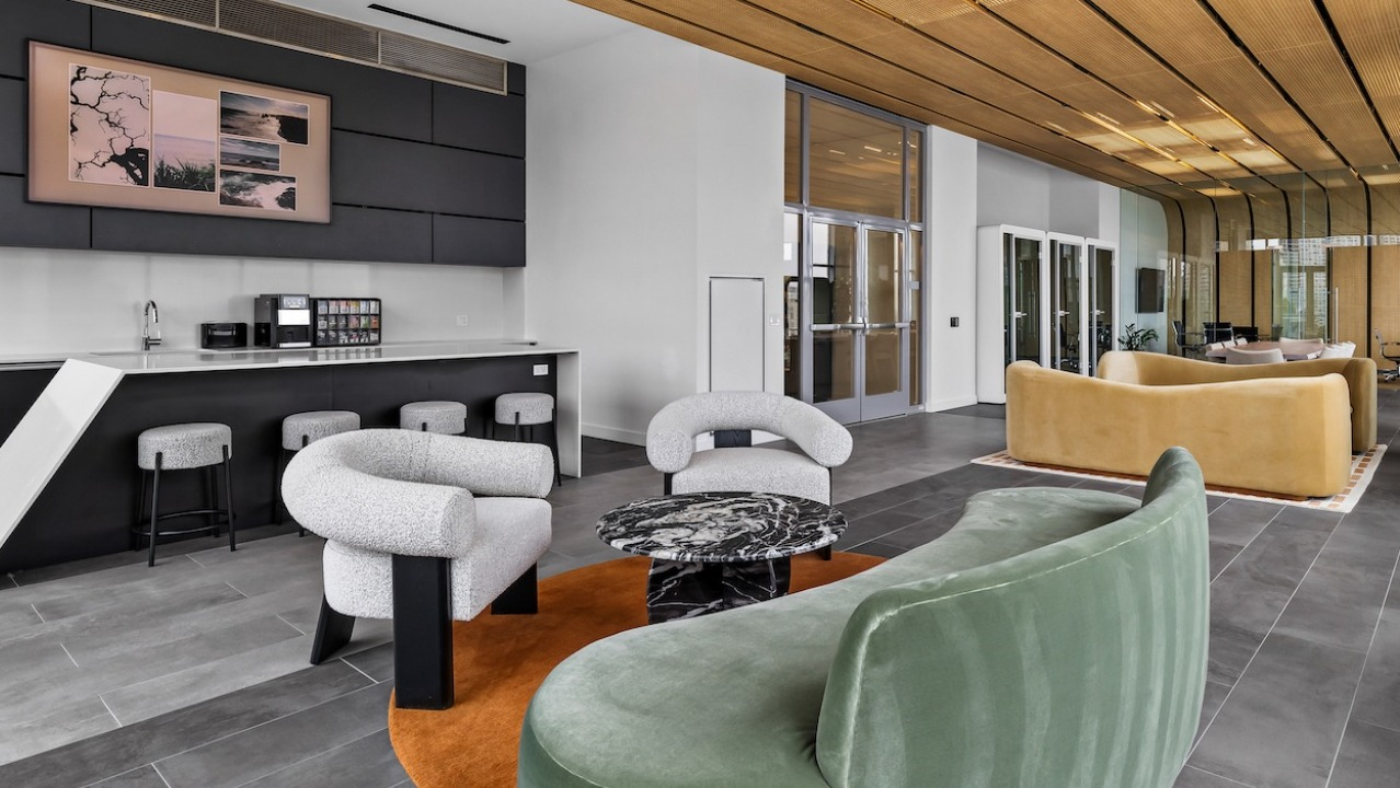 Contemporary lounge at 3Eleven Luxury Apartments in Chicago with modern seating, bar area, and stylish ceiling design