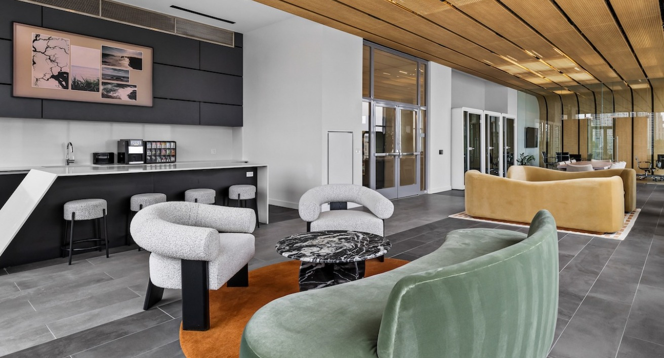 Contemporary lounge at 3Eleven Luxury Apartments in Chicago with modern seating, bar area, and stylish ceiling design