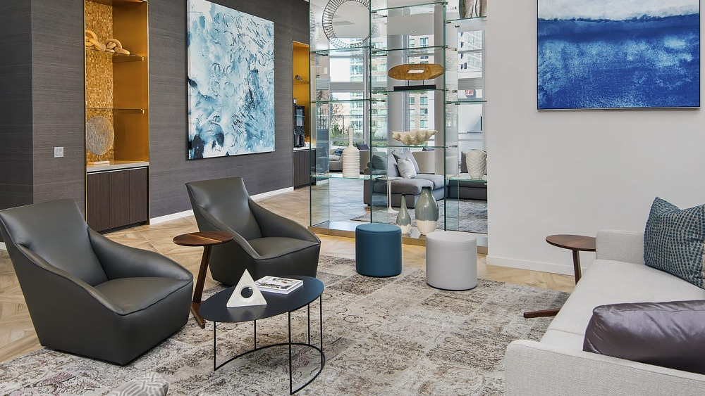 Contemporary resident lounge with artwork, accent lighting, and stylish seating at 465 North Park apartments in Chicago