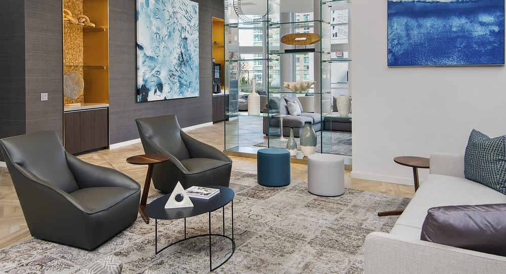 Contemporary resident lounge with artwork, accent lighting, and stylish seating at 465 North Park apartments in Chicago