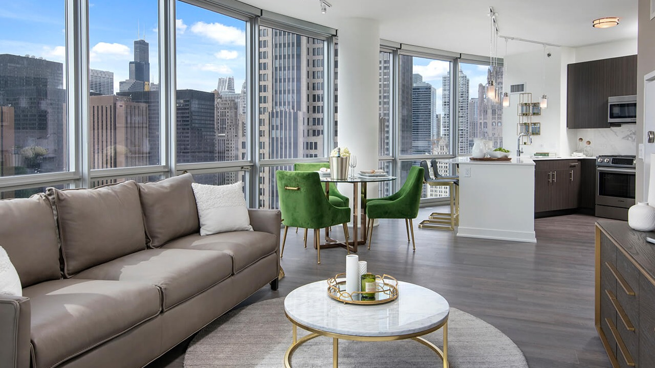 Open living area with contemporary furnishings, dining space, and skyline views at 465 North Park apartments in Chicago