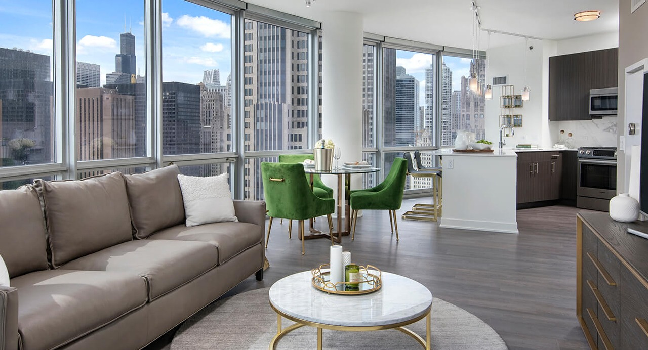 Open living area with contemporary furnishings, dining space, and skyline views at 465 North Park apartments in Chicago