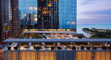 Glass high-rise building with lakefront views and modern design at 500 Lake Shore Drive apartments in Chicago