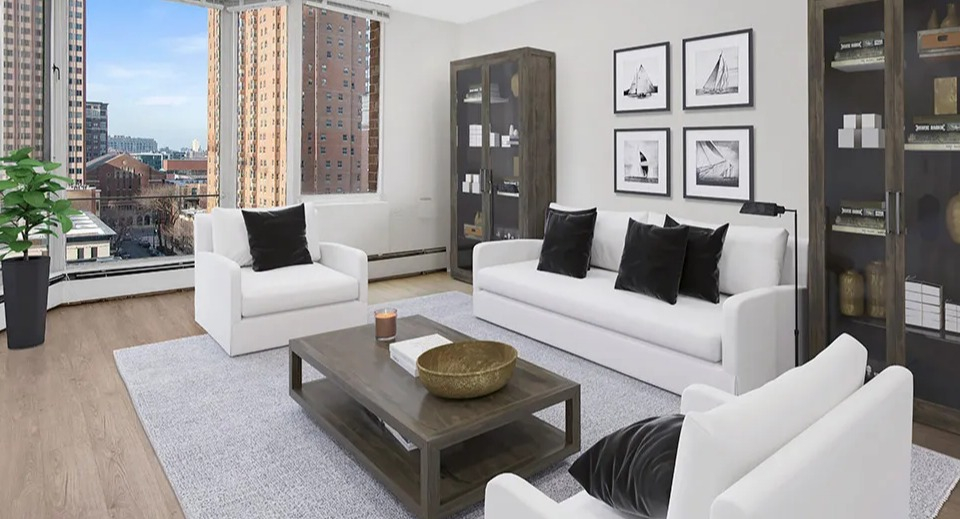 Spacious living room with large bay windows, white sofa set, gray rug, and display cabinets showcasing city views at 55 West Chestnut apartments in Chicago