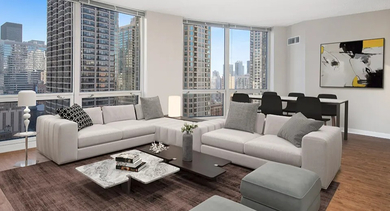 Spacious living and dining area with large windows, modern seating, and hardwood floors at 750 N Rush St apartments in Chicago, showcasing an open layout and skyline views