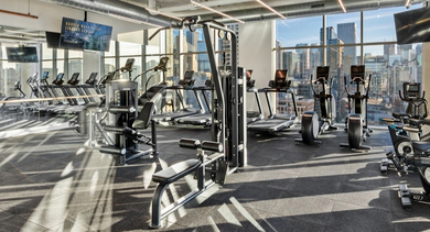 On-site fitness center at AMLI 808 apartments in Chicago with cardio machines and free weights, making daily workouts convenient for residents