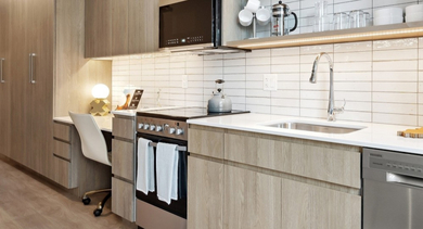 Modern kitchen at AMLI 808 apartments in Chicago with sleek cabinetry, stainless appliances, and generous counter space for cooking and entertaining