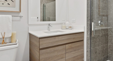 Modern bathroom with glass shower, sleek vanity, and bright finishes at AMLI 808 apartments in Chicago, designed for comfort and everyday convenience