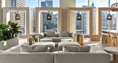 Resident lounge at AMLI 808 in Chicago with plush seating, TV areas, and gathering spaces—ideal for relaxing, socializing, or hosting friends