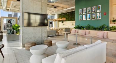 Resident lounge at AMLI 808 apartments in Chicago with comfortable seating and ample natural light, a social space for work, study, or casual meetups