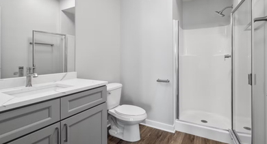 Contemporary bathroom at AMLI 900 featuring a sleek vanity with ample mirror, polished fixtures, and clean lines that create a spa-inspired feel in Chicago