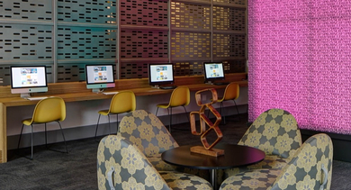 Vibrant business center with multiple computer workstations and comfortable seating at AMLI Lofts in Chicago