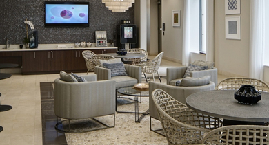 Inviting resident lounge at AMLI River North, offering various comfortable seating arrangements and a relaxed atmosphere