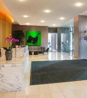 Elegant lobby entrance with modern design and a welcoming atmosphere at Aqua at Lakeshore East in Chicago