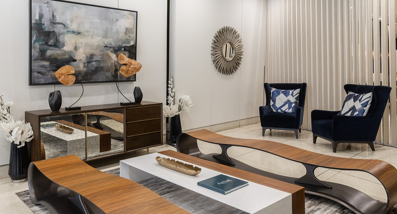 Elegant resident lounge area with modern artwork, comfortable seating, and sophisticated decor for relaxation at Arrive LEX in Chicago