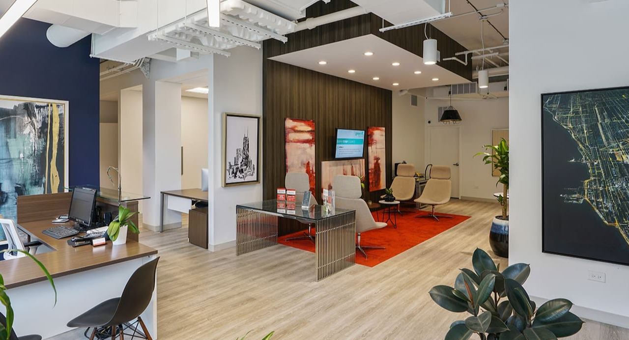 Modern leasing office at Arrive South Loop apartments, featuring contemporary design, comfortable seating, and helpful staff in Chicago