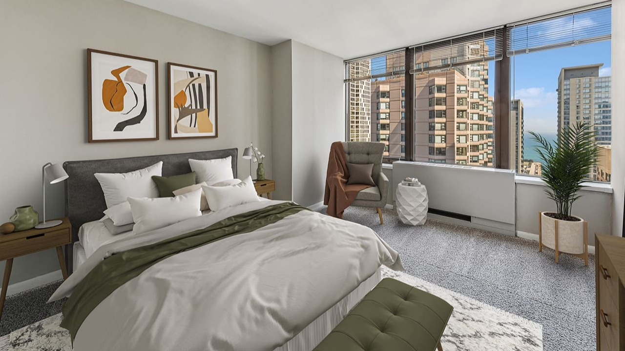 Cozy bedroom at Arrive Streeterville with a large bed, abstract art, and stunning city views
