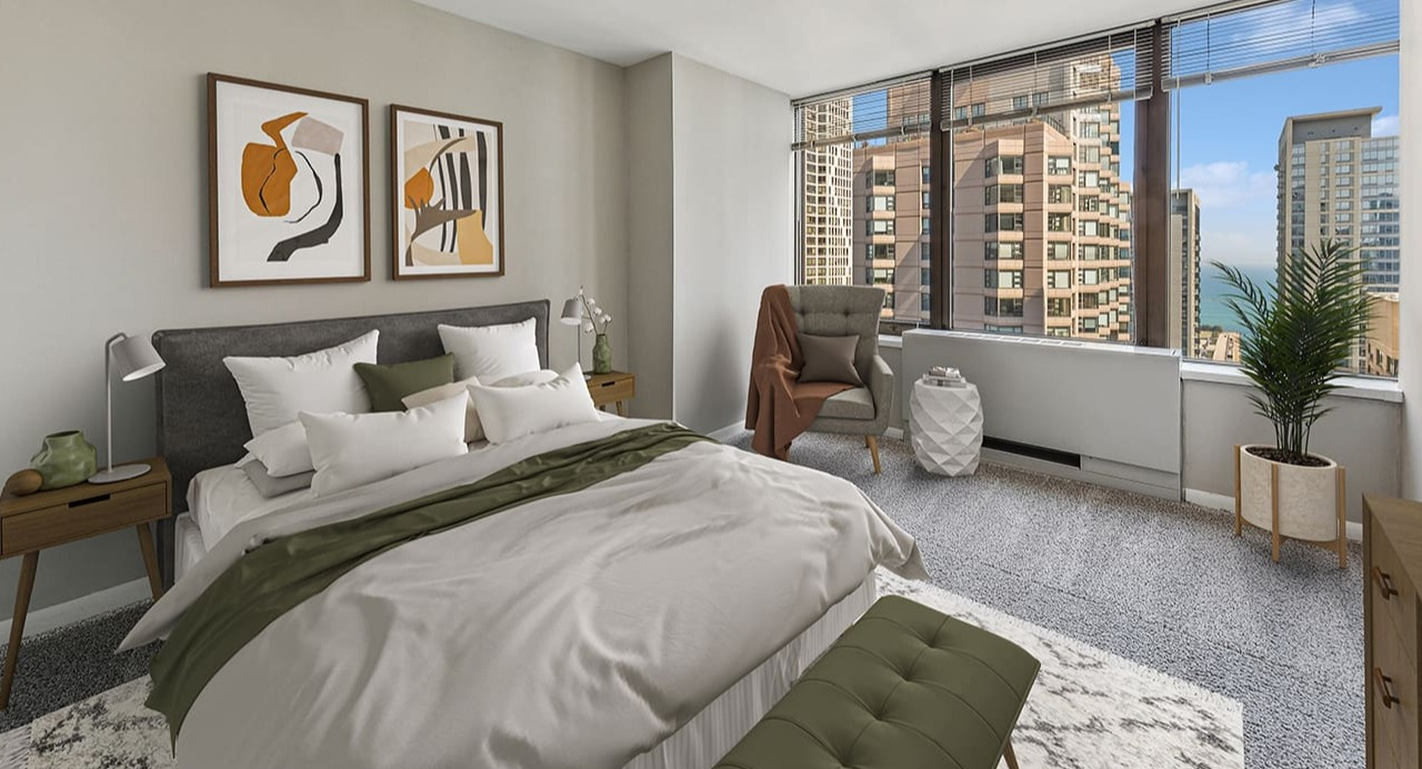 Cozy bedroom at Arrive Streeterville with a large bed, abstract art, and stunning city views