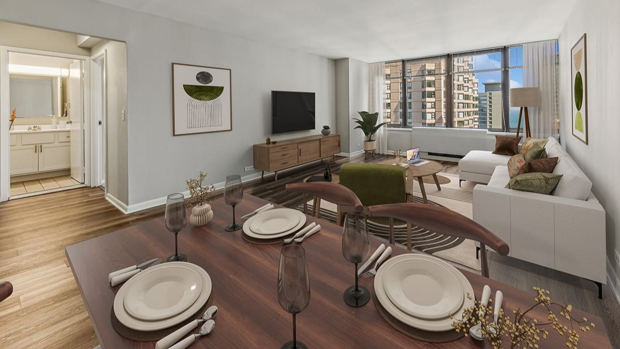 Open dining and living area at Arrive Streeterville with modern furniture, a dining table, and city views