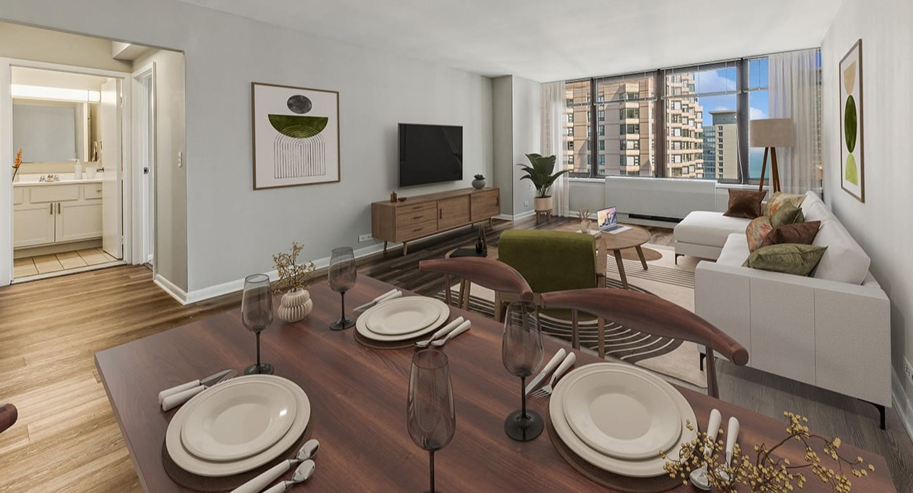 Open dining and living area at Arrive Streeterville with modern furniture, a dining table, and city views