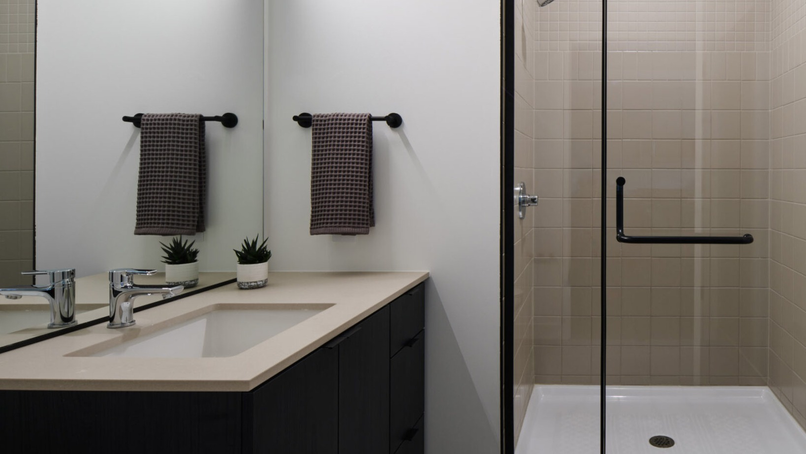 Modern bathroom in an Arthur on Aberdeen apartment in Chicago, complete with a sleek vanity and walk-in shower