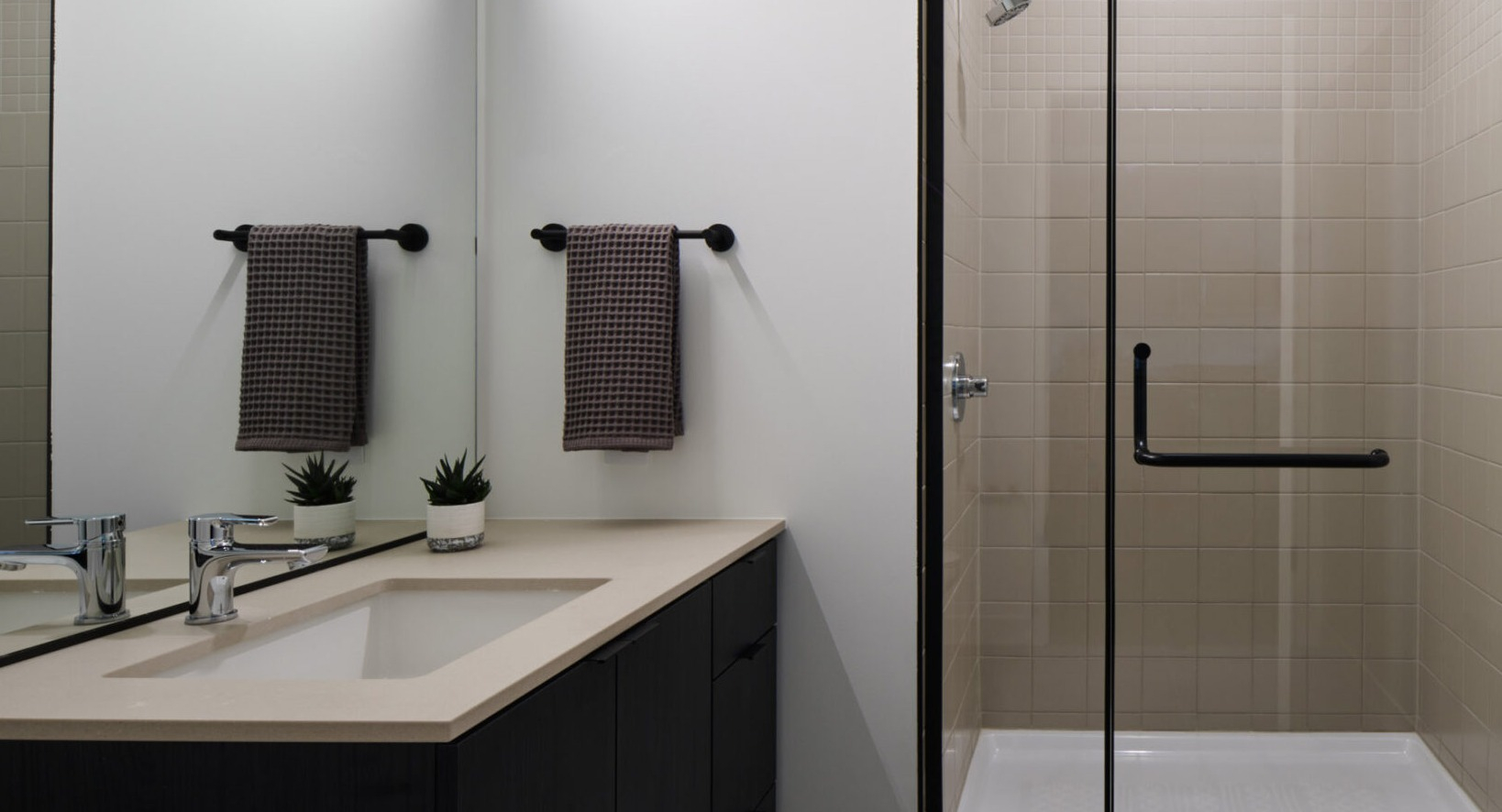 Modern bathroom in an Arthur on Aberdeen apartment in Chicago, complete with a sleek vanity and walk-in shower