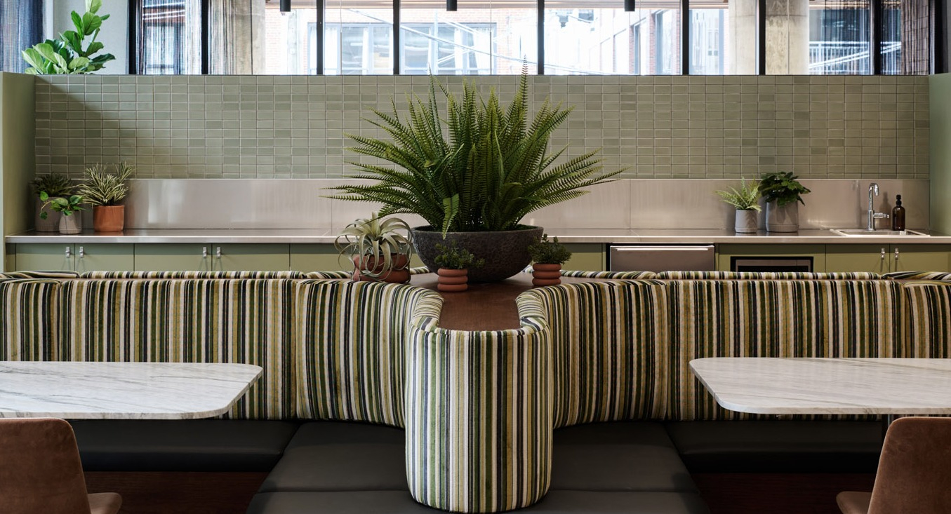 Charming cafe-style seating area at Arthur on Aberdeen in Chicago, featuring comfortable banquettes and individual tables