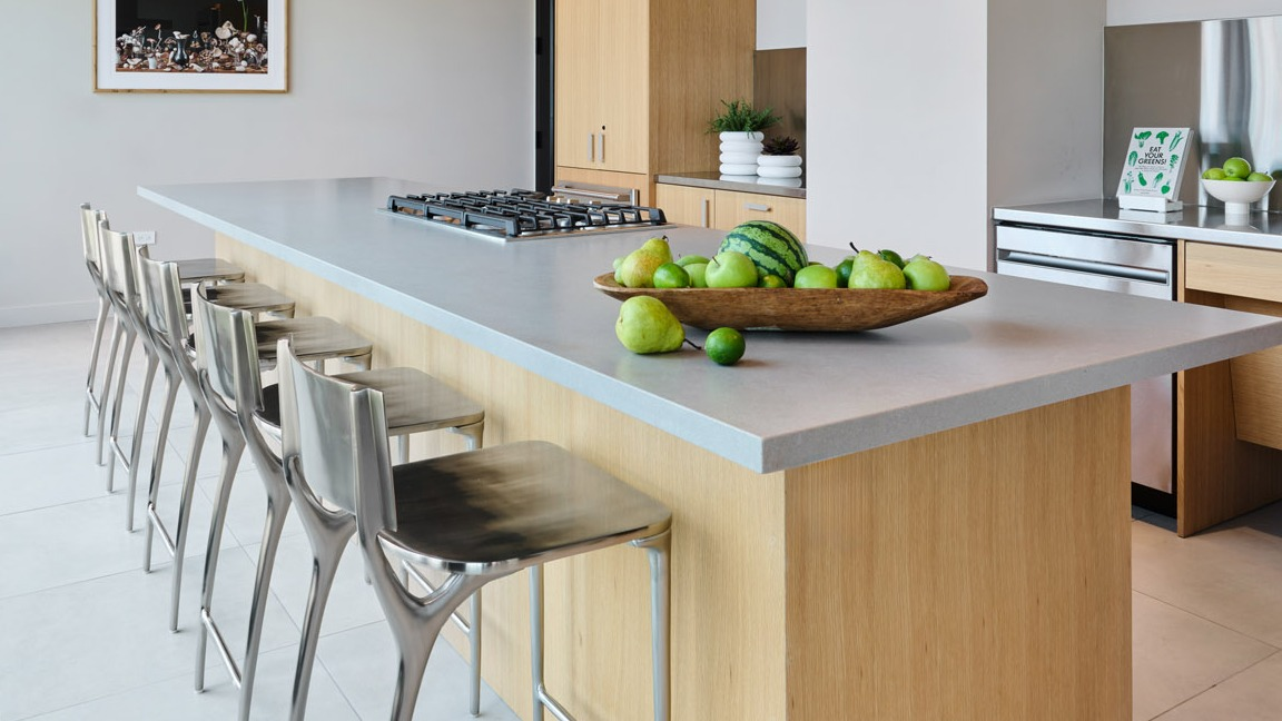 Spacious gourmet kitchen with a large island and bar seating at Arthur on Aberdeen in Chicago, ideal for entertaining