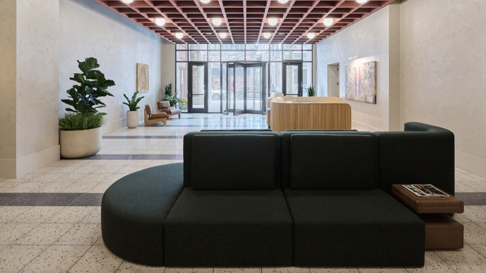 Inviting lobby seating area at Arthur on Aberdeen in Chicago, with modern furniture and a warm, stylish ambiance