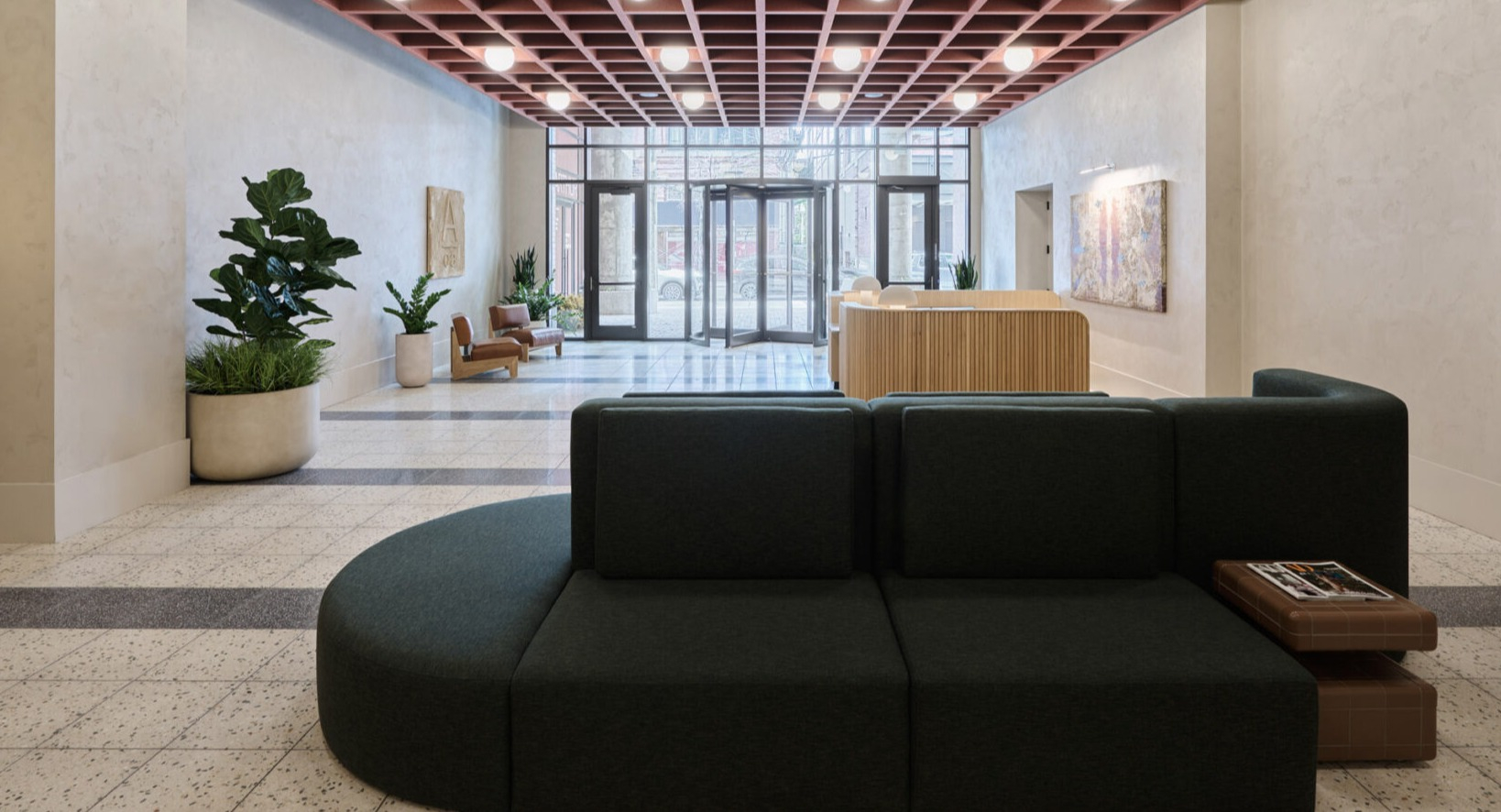 Inviting lobby seating area at Arthur on Aberdeen in Chicago, with modern furniture and a warm, stylish ambiance