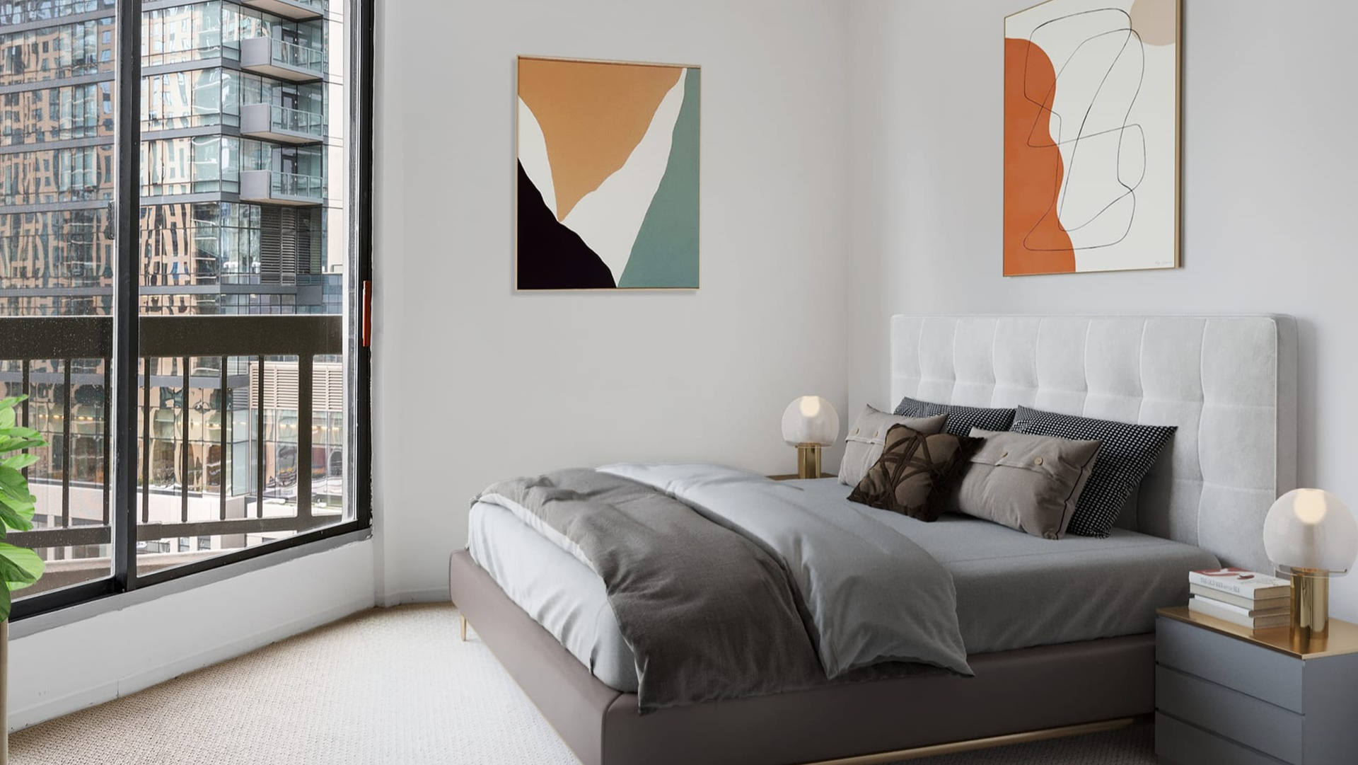 Contemporary bedroom at Asbury Plaza in Chicago with a comfortable bed, abstract art, and city views