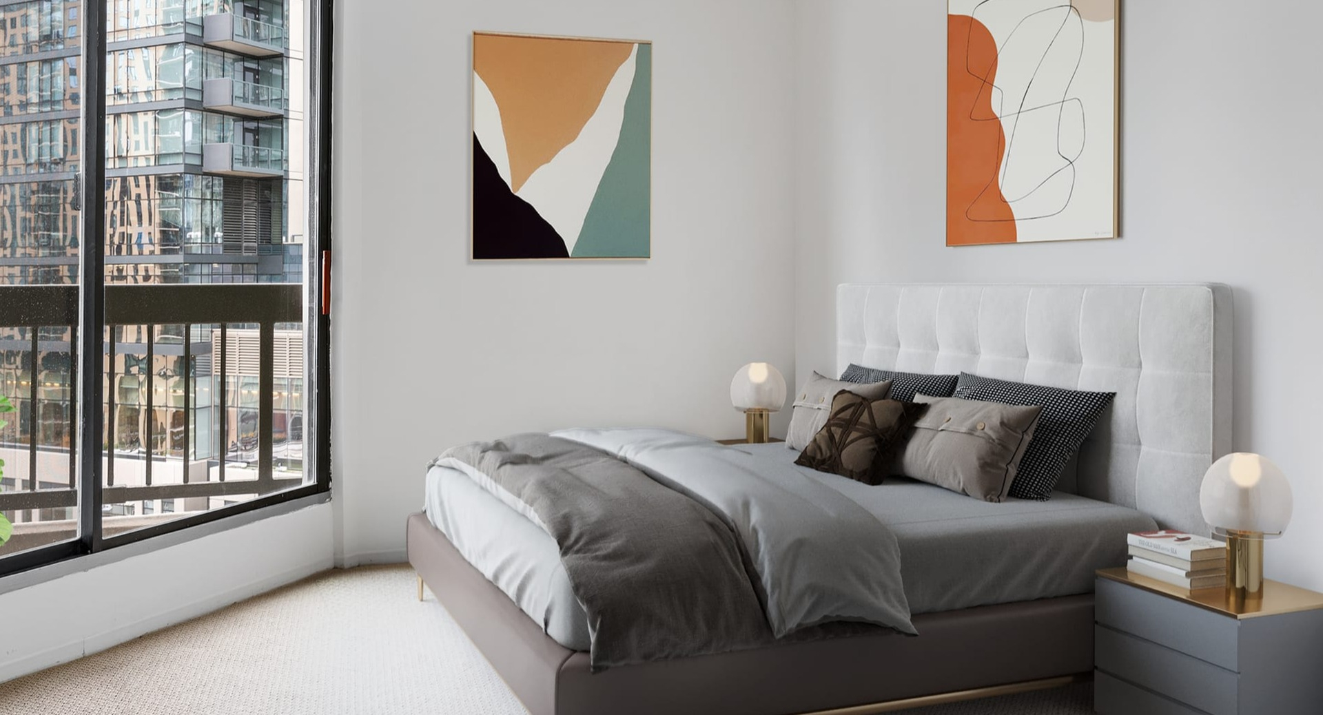 Contemporary bedroom at Asbury Plaza in Chicago with a comfortable bed, abstract art, and city views