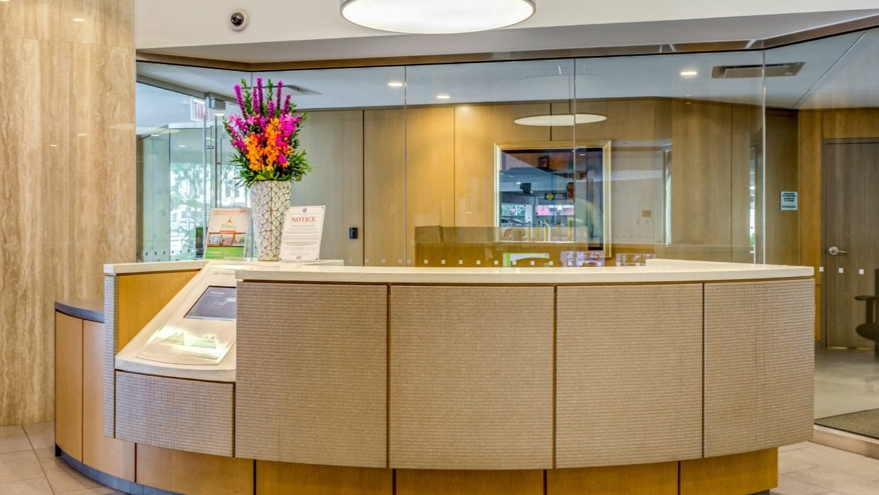 Elegant lobby and reception area at Asbury Plaza in Chicago, with stylish decor and a welcoming desk