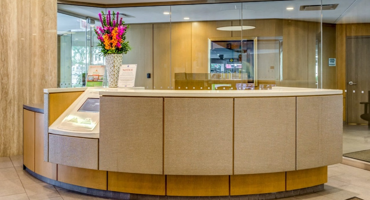 Elegant lobby and reception area at Asbury Plaza in Chicago, with stylish decor and a welcoming desk