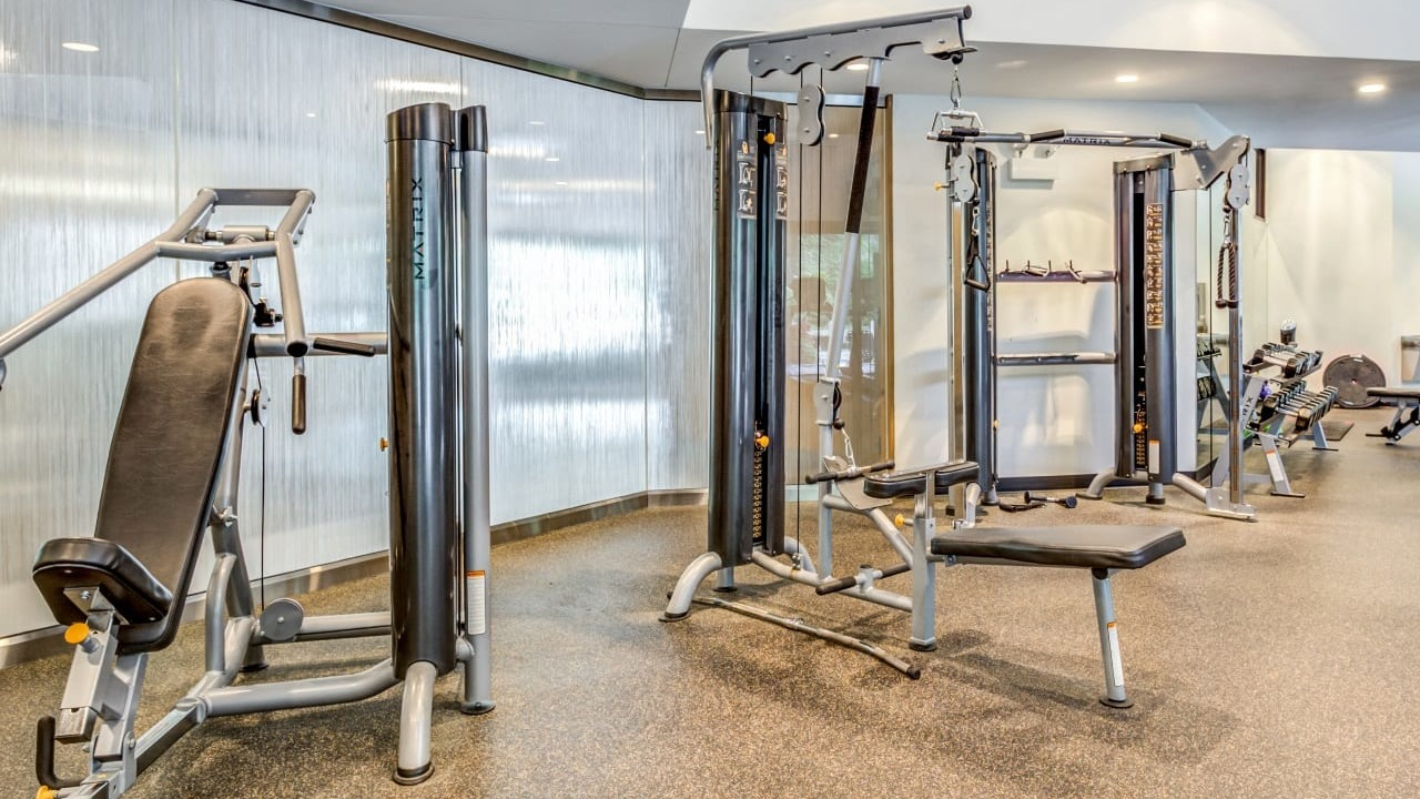Strength training area in the Asbury Plaza fitness center in Chicago, equipped with various machines