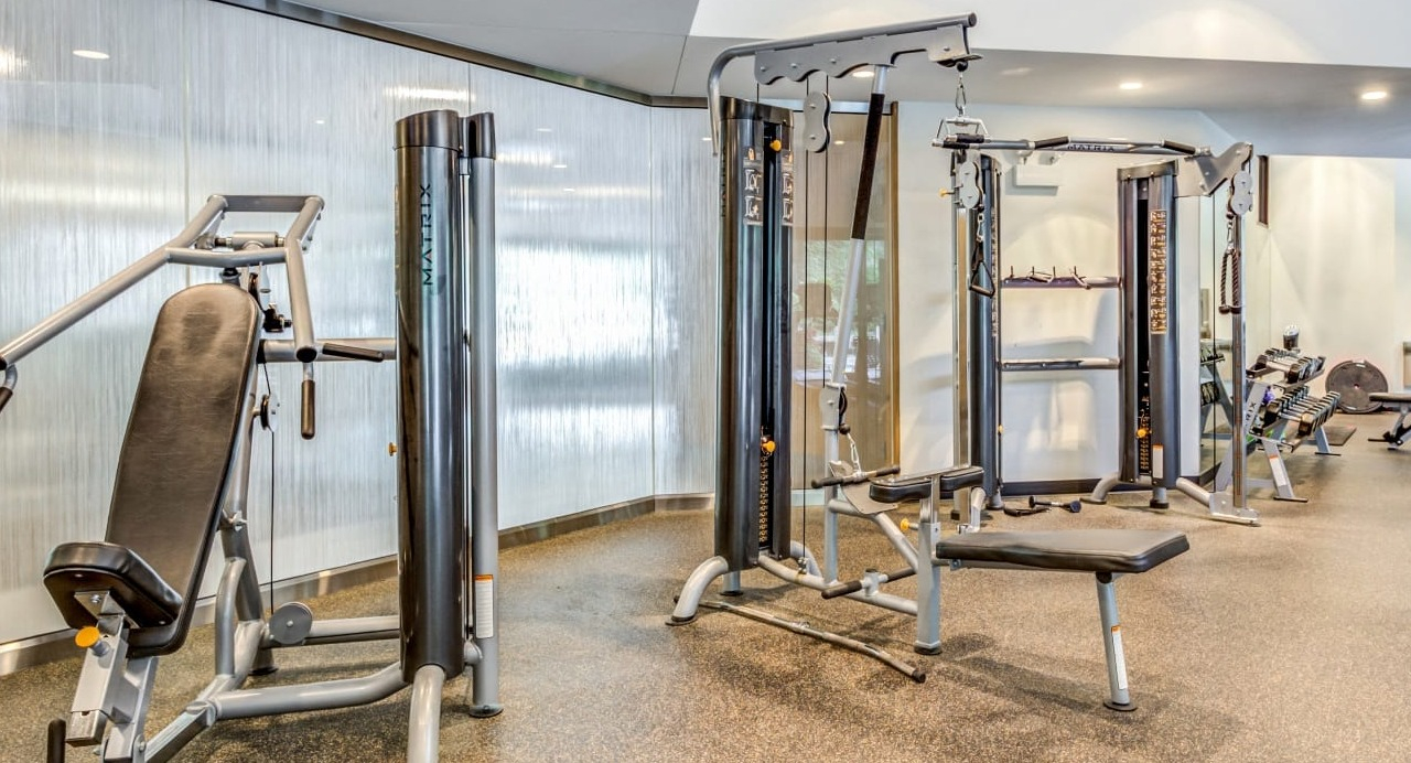 Strength training area in the Asbury Plaza fitness center in Chicago, equipped with various machines