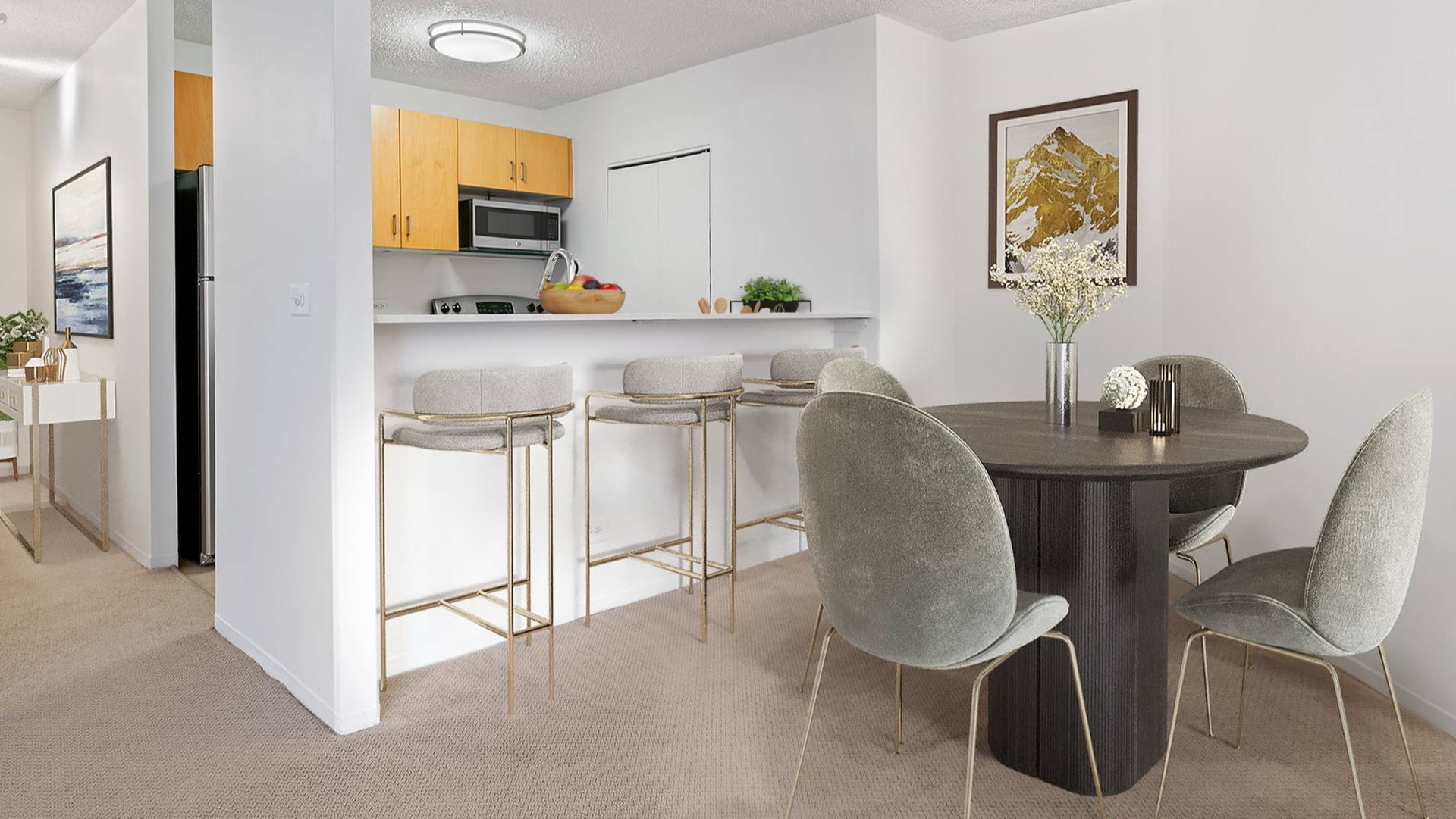 Open-concept kitchen and dining area at Asbury Plaza in Chicago, featuring a breakfast bar and modern table
