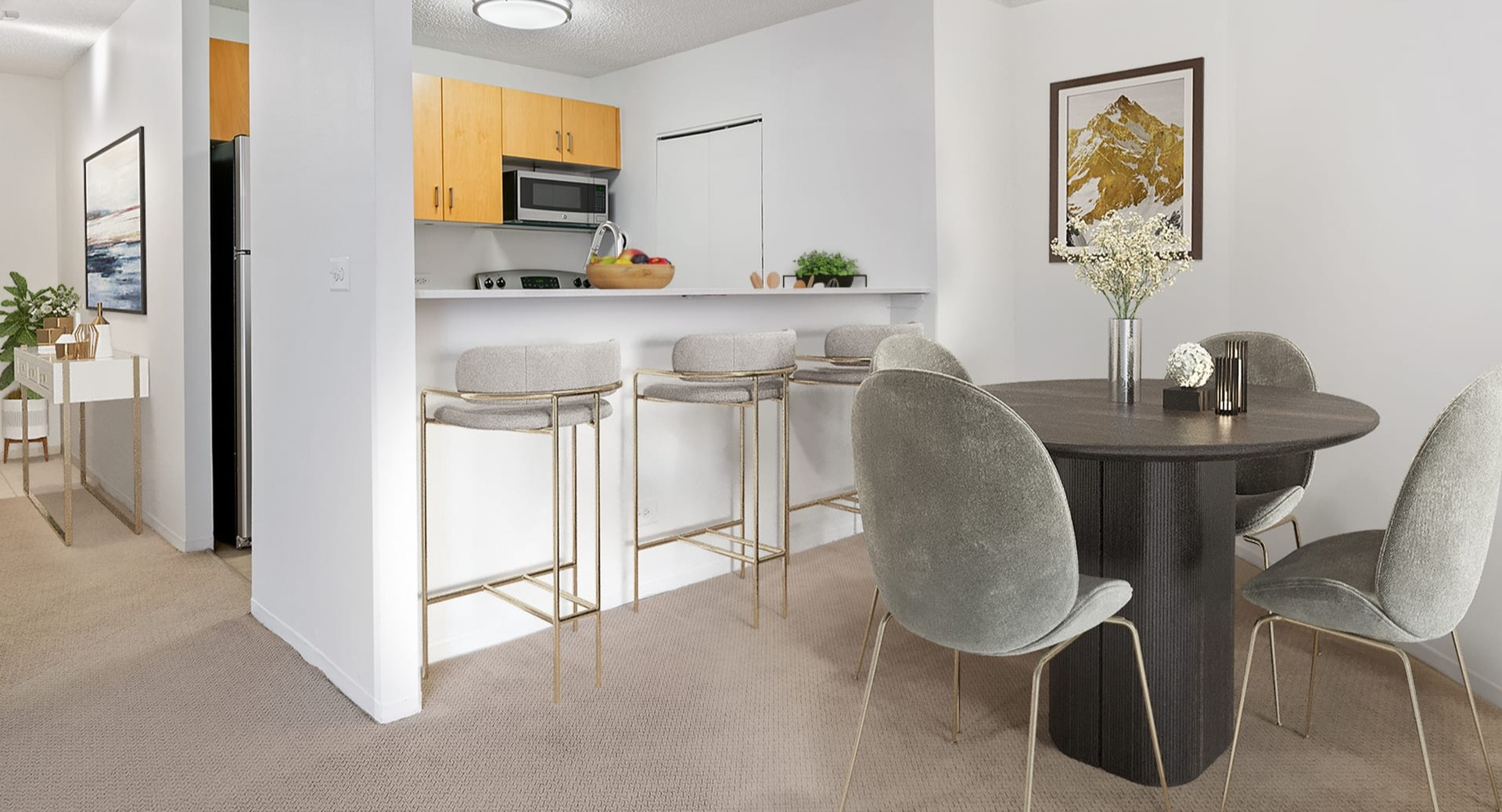 Open-concept kitchen and dining area at Asbury Plaza in Chicago, featuring a breakfast bar and modern table