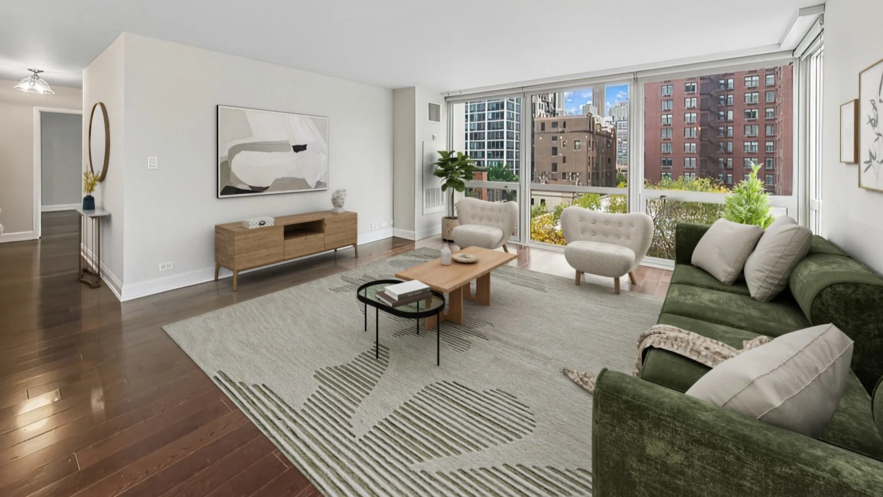 Bright living room with large windows, city views, comfortable seating, and modern decor at Astor House Apartments in Chicago
