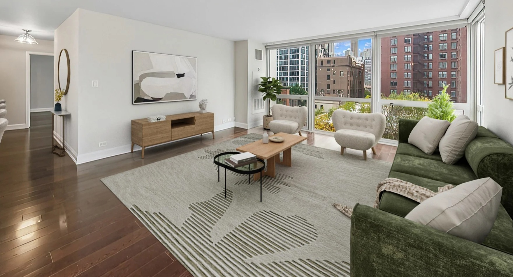 Bright living room with large windows, city views, comfortable seating, and modern decor at Astor House Apartments in Chicago