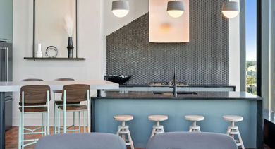 Modern open-concept kitchen and dining area at Avra West Loop in Chicago, featuring stylish finishes