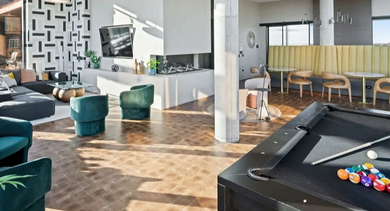 Spacious recreational game room at Avra West Loop in Chicago, complete with a billiards table